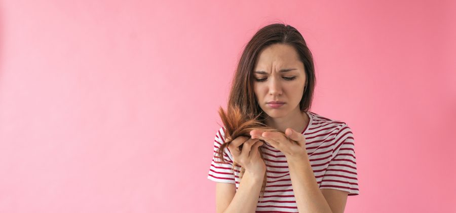 What causes greasy hair and how can I prevent it?