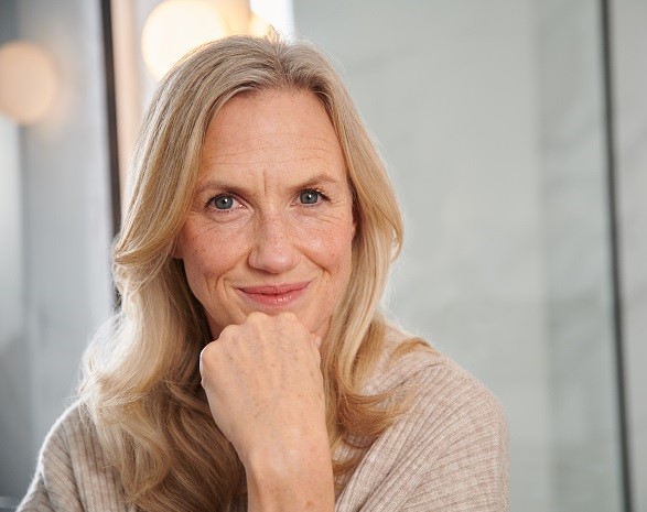 mature woman smiling at camera 