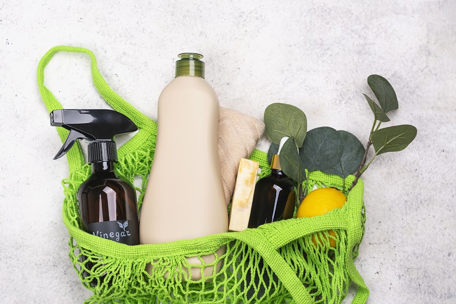 eco-friendly cleaning products in green cotton bag